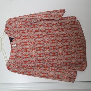 Orange patterned blouse